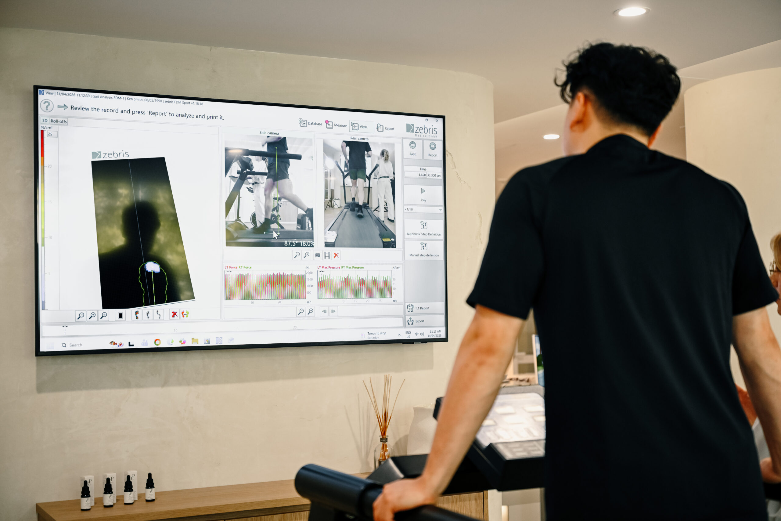 Podiatrist assessing a patient’s walking and running gait using advanced biomechanical analysis technology